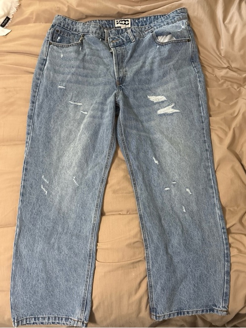 Asymmetrical Waist Light Blue Distressed Women’s Jeans